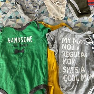 Lot of 13 onesies for 6 month old boy. Mix of long & short sleeves.